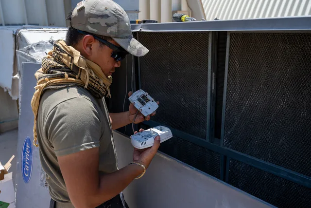 A heating, ventilation and air conditioning technician assigned to the 379th Expeditionary Civil Engineer Squadron inspects a thermostat at an undisclosed location within the U.S. Central Command area of responsibility, June 26, 2024. Prolonged temperatures above 115 degrees Fahrenheit can cause fai. How HVAC contractors can structure pricing to protect profit