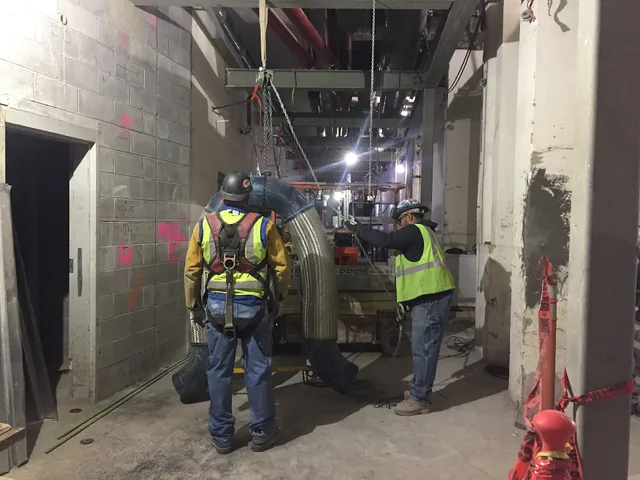 Preparing ductwork for installation along the west service corridor of the future LIRR passenger concourse. (CM014B, 01-30-2019). Why US ductwork rates do not translate to Canadian jobs